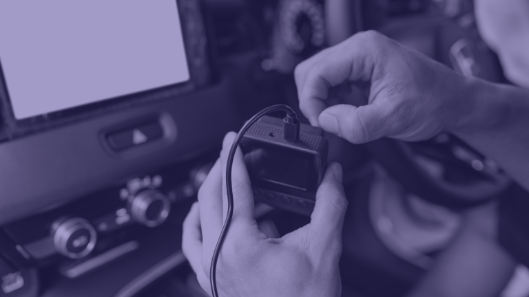 Person plugging in asset tracker.